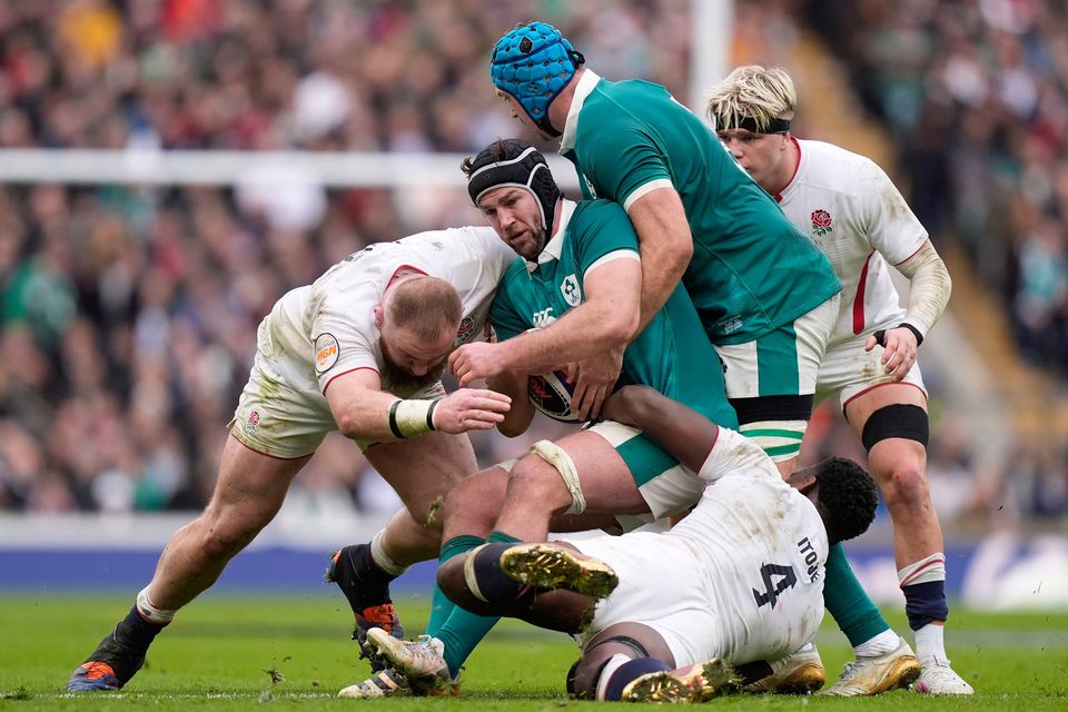 Ireland's Caelan Doris tackled by England's Joe Heyes (left) and Maro Itoje during the Six Nations match at the Allianz Stadium Twickenham, London. Photo: Andrew Matthews/PA Wire